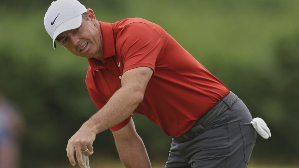 Buried ball baffles McIlroy in wild ride for hometown hero at British Open