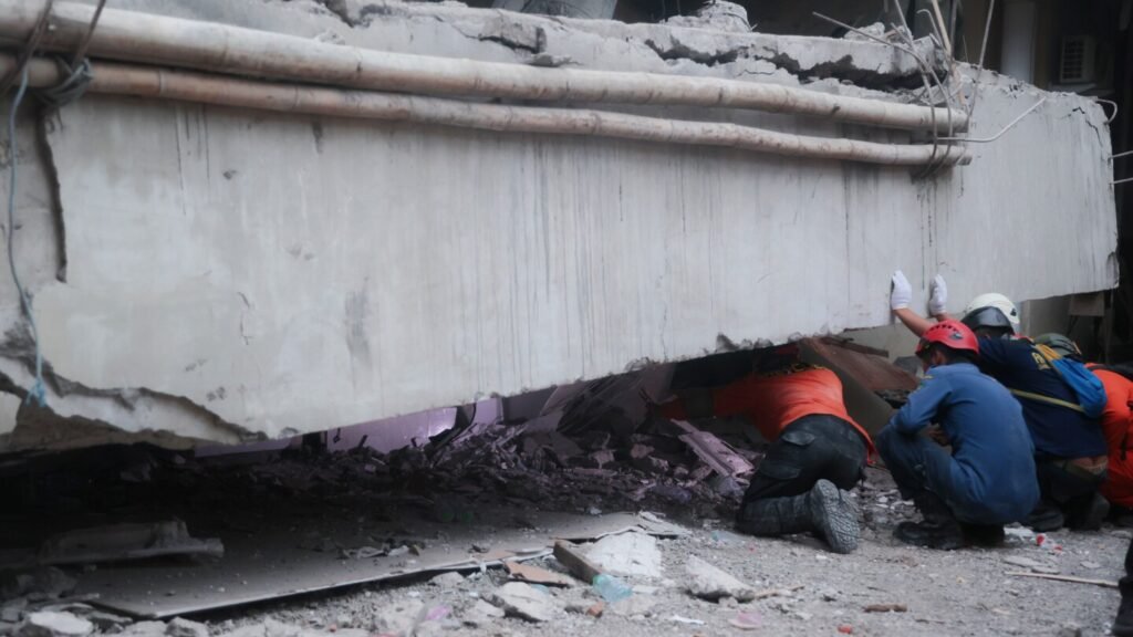 At least 91 students remain buried in rubble 2 days after school collapse in Indonesia