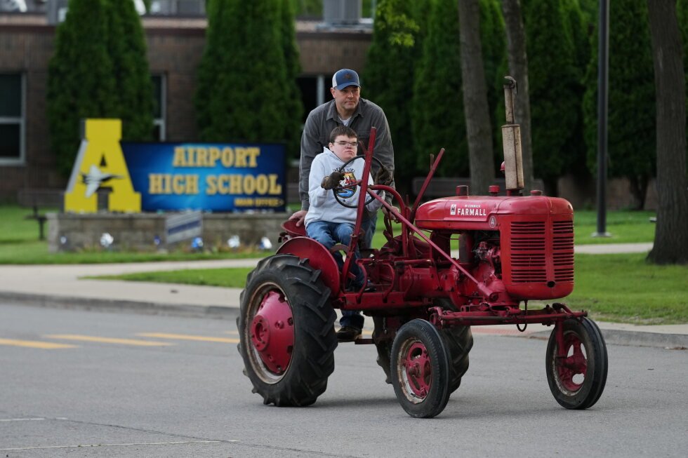 Seniors roll into Michigan high school during annual Tractor Day celebration